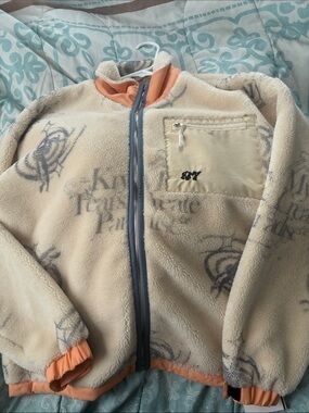 Roxy Cream Fleece Jacket with Light Blue Trim and Orange Cuffs